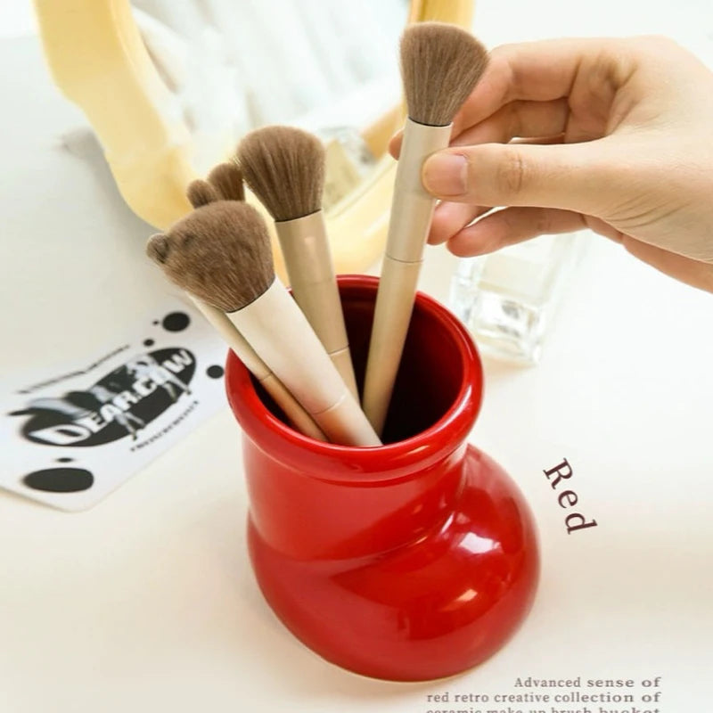 Artistic Red Boots Desk Storage with Christmas Decorations