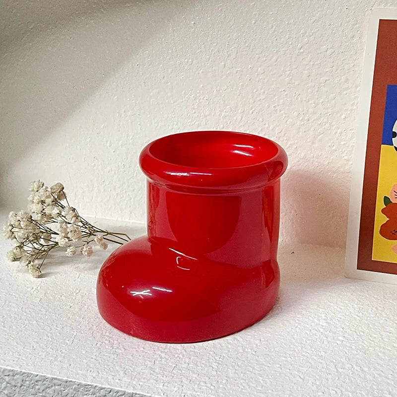 Artistic Red Boots Desk Storage with Christmas Decorations