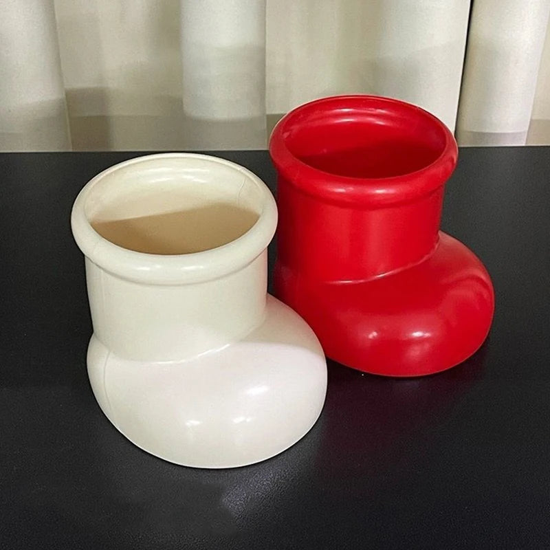 Artistic Red Boots Desk Storage with Christmas Decorations